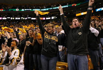 BOSTON - MAY 14:  Boston Bruins fans cheer in the first period against the Carolina Hurricanes during Game Seven of the Eastern Conference Semifinal Round of the 2009 Stanley Cup Playoffs on May 14, 2009 at the TD Banknorth Garden in Boston, Massachusetts. The Hurricanes defeated the Bruins 3-2 in overtime.  (Photo by Elsa/Getty Images)