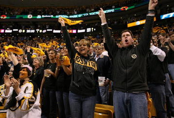 BOSTON - MAY 14:  Boston Bruins fans cheer in the first period against the Carolina Hurricanes during Game Seven of the Eastern Conference Semifinal Round of the 2009 Stanley Cup Playoffs on May 14, 2009 at the TD Banknorth Garden in Boston, Massachusetts. The Hurricanes defeated the Bruins 3-2 in overtime.  (Photo by Elsa/Getty Images)