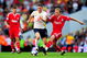 LONDON, ENGLAND - AUGUST 16: Robbie Keane of Tottenham is challenged by Lucas Leiva of Liverpool during the Barclays Premier League match between Tottenham Hotspur and Liverpool at White Hart Lane on August 16, 2009 in London, England. (Photo by Mike Hewitt/Getty Images)