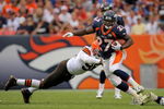 DENVER - SEPTEMBER 20:  Running back Knowshon Moreno #27 of the Denver Broncos eludes a tackle by linebacker David Bowens #96 of the Cleveland Browns during NFL action at Invesco Field at Mile High on September 20, 2009 in Denver, Colorado. The Broncos defeated the Browns 27-6.  (Photo by Doug Pensinger/Getty Images)
