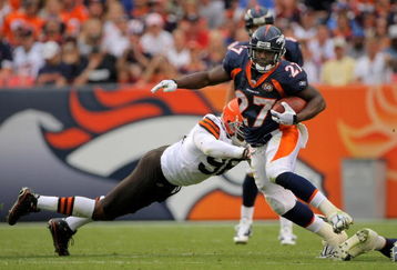DENVER - SEPTEMBER 20:  Running back Knowshon Moreno #27 of the Denver Broncos eludes a tackle by linebacker David Bowens #96 of the Cleveland Browns during NFL action at Invesco Field at Mile High on September 20, 2009 in Denver, Colorado. The Broncos defeated the Browns 27-6.  (Photo by Doug Pensinger/Getty Images)