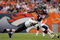 DENVER - SEPTEMBER 20:  Running back Knowshon Moreno #27 of the Denver Broncos eludes a tackle by linebacker David Bowens #96 of the Cleveland Browns during NFL action at Invesco Field at Mile High on September 20, 2009 in Denver, Colorado. The Broncos defeated the Browns 27-6.  (Photo by Doug Pensinger/Getty Images)