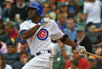 CHICAGO - AUGUST 28: Milton Bradley #21 of the Chicago Cubs hits the ball against the New York Mets on August 28, 2009 at Wrigley Field in Chicago, Illinois. The Cubs defeated the Mets 5-2. (Photo by Jonathan Daniel/Getty Images)