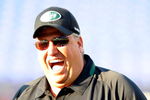 BALTIMORE - AUGUST 24:  Head coach Rex Ryan (R) of the New York Jets talks with players before a game against the Baltimore Ravens at M&T Bank Stadium on August 24, 2009 in Baltimore, Maryland.  (Photo by Greg Fiume/Getty Images)