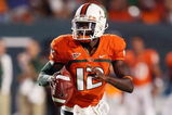 FORT LAUDERDALE, FL - SEPTEMBER 17: Quarterback Jacory Harris #12 of the Miami Hurricanes scrambles against the Georgia Tech Yellow Jackets at Land Shark Stadium on September 17, 2009 in Fort Lauderdale, Florida.  (Photo by Doug Benc/Getty Images)