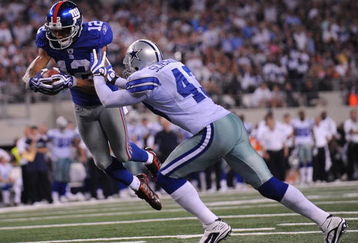 ARLINGTON, TX - SEPTEMBER 20:  Wide receiver Steve Smith #12 of the New York Giants dives for a touchdown against Gerald Sensabaugh #43 of the Dallas Cowboys at Cowboys Stadium on September 20, 2009 in Arlington, Texas.  (Photo by Ronald Martinez/Getty Images)