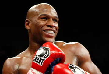 LAS VEGAS - SEPTEMBER 19:  Floyd Mayweather Jr. smiles in the ring during his fight against Juan Manuel Marquez at the MGM Grand Garden Arena September 19, 2009 in Las Vegas, Nevada. Mayweather won by unanimous decision.  (Photo by Ethan Miller/Getty Images)