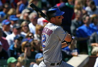 CHICAGO - AUGUST 30: Jeff Francoeur #12 of the New York Mets hits the ball against the Chicago Cubs on August 30, 2009 at Wrigley Field in Chicago, Illinois. The Mets defeated the Cubs 4-1. (Photo by Jonathan Daniel/Getty Images)
