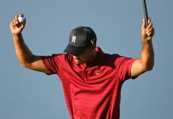 LEMONT, IL - SEPTEMBER 13: Tiger Woods reacts on the 18th green after winning the BMW Championship at Cog Hill Golf & Country Club on September 13, 2009 in Lemont, Illinois. (Photo by Hunter Martin/Getty Images)