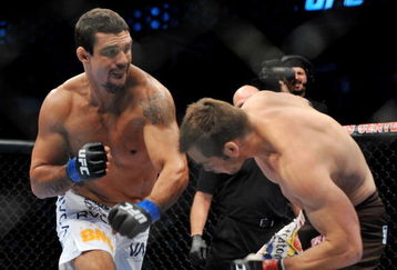 DALLAS - SEPTEMBER 19:  UFC fighter Vitor Belfort  (L) battles UFC fighter Rich Franklin (R) during their Catch weight bout at UFC 103: Franklin vs. Belfort at the American Airlines Center on September 19, 2009 in Dallas, Texas.  (Photo by Jon Kopaloff/Getty Images)