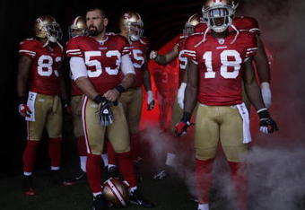 SAN FRANCISCO - SEPTEMBER 20:  The San Francisco 49ers starting line up prepare to enter the field during their home opener against the Seattle Seahawks at Candlestick Park on September 20, 2009 in San Francisco, California.  (Photo by David Paul Morris/Getty Images)