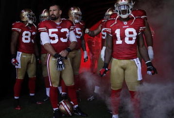 SAN FRANCISCO - SEPTEMBER 20:  The San Francisco 49ers starting line up prepare to enter the field during their home opener against the Seattle Seahawks at Candlestick Park on September 20, 2009 in San Francisco, California.  (Photo by David Paul Morris/Getty Images)