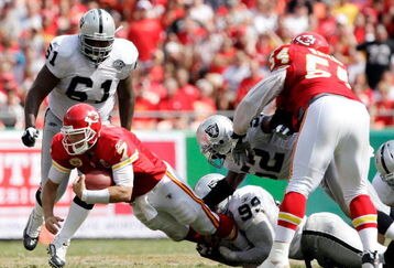 KANSAS CITY, MO - SEPTEMBER 20:  Quarterback Matt Cassel #7 of the Kansas City Chiefs is sacked by Kirk Morrison #52 and Greg Ellis #99 of the Oakland Raiders during the game at Arrowhead Stadium on September 20, 2009 in Kansas City, Missouri.  (Photo by Jamie Squire/Getty Images)