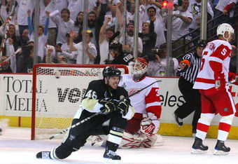 PITTSBURGH - JUNE 04:  Tyler Kennedy #48 of the Pittsburgh Penguins reacts after scoring against goaltender Chris Osgood #30 of the Detroit Red Wings during Game Four of the 2009 NHL Stanley Cup Finals on June 4, 2009 at Mellon Arena in Pittsburgh, Pennsylvania.  (Photo by Jim McIsaac/Getty Images)
