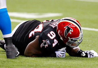 ATLANTA - SEPTEMBER 20:  Peria Jerry #94 of the Atlanta Falcons lays on the field after being injured against the Carolina Panthers at Georgia Dome on September 20, 2009 in Atlanta, Georgia.  (Photo by Kevin C. Cox/Getty Images)