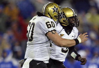 LEXINGTON, KY - NOVEMBER 15:  Chris Nickson #3 and Bradley Vierling #60 of the Vanderbilt Commodores celebrate a touchdown pass by Nickson during the game against the Kentucky Wildcats on November 15, 2008 at Commonwealth Stadium in Lexington, Kentucky.  (Photo by Andy Lyons/Getty Images)