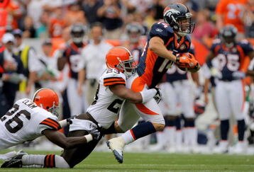 DENVER - SEPTEMBER 20:  Wide reciever Brandon Stokley #14 of the Denver Broncos makes a 47 yard reception and is tackled by Hank Poteat #23 of the Cleveland Browns during NFL action at Invesco Field at Mile High on September 20, 2009 in Denver, Colorado.  (Photo by Doug Pensinger/Getty Images)
