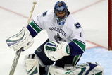 CHICAGO - MAY 07:  Goalie Roberto Luongo #1 of the Vancouver Canucks makes a save against the Chicago Blackhawks during Game Four of the Western Conference Semifinal Round of the 2009 Stanley Cup Playoffs on May 7, 2009 at the United Center in Chicago, Illinois.  (Photo by Jonathan Daniel/Getty Images)