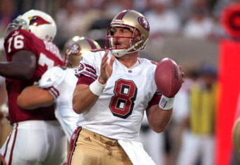 27 Sep 1999: Steve Young #8 of the San Francisco 49ers moves back to pass the ball during the game against the Arizona Cardinals at the Sun Devil Stadium in Tempe, Arizona. The 49ers defeated the Cardinals 24-10.