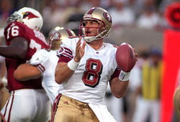 27 Sep 1999: Steve Young #8 of the San Francisco 49ers moves back to pass the ball during the game against the Arizona Cardinals at the Sun Devil Stadium in Tempe, Arizona. The 49ers defeated the Cardinals 24-10.