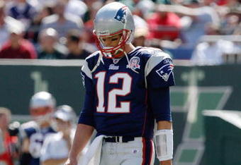 EAST RUTHERFORD, NJ - SEPTEMBER 20: Tom Brady #12 of the New England Patriots walks to the huddle during the game on September 20, 2009 at Giants Stadium in East Rutherford, New Jersey. (Photo by Jared Wickerham/Getty Images)