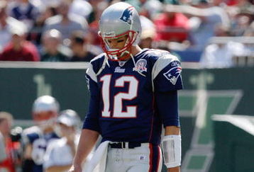 EAST RUTHERFORD, NJ - SEPTEMBER 20: Tom Brady #12 of the New England Patriots walks to the huddle during the game on September 20, 2009 at Giants Stadium in East Rutherford, New Jersey. (Photo by Jared Wickerham/Getty Images)