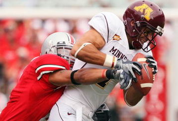 COLUMBUS, OH - SEPTEMBER 27:  Wide receiver Eric Decker #7 of the Minnesota Golden Gophers holds onto a pass reception as Kurt Coleman #4 of the Ohio State Buckeyes makes the tackle on September 27, 2008 at Ohio Stadium in Columbus, Ohio.  (Photo by Jamie Sabau/Getty Images)