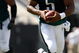 CHARLOTTE, NC - SEPTEMBER 13:  Quarterback Donovan McNabb #5 of the Philadelphia Eagles runs with the ball in the second half of their NFL season opener against the Carolina Panthers at Bank of America Stadium on September 13, 2009 in Charlotte, North Carolina. McNabb did not return to the game.  (Photo by Streeter Lecka/Getty Images)