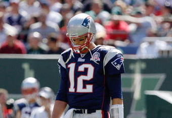 EAST RUTHERFORD, NJ - SEPTEMBER 20: Tom Brady #12 of the New England Patriots walks to the huddle during the game on September 20, 2009 at Giants Stadium in East Rutherford, New Jersey. (Photo by Jared Wickerham/Getty Images)