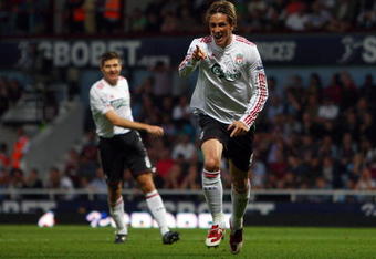 LONDON, ENGLAND - SEPTEMBER 19:  Fernando Torres of Liverpool celebrates scoring the third goal during the Barclays Premier League match between West Ham United and Liverpool at Upton Park on September 19, 2009 in London, England.  (Photo by Jamie McDonald/Getty Images)