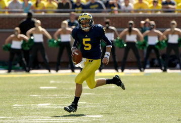 ANN ARBOR, MI - SEPTEMBER 19:  Quarterback Tate Forcier #5 of the Michigan Wolverines carries the ball against the Eastern Michigan Eagles at Michigan Stadium on September 19, 2009 in Ann Arbor, Michigan.   Michigan won 45-17.  (Photo by Stephen Dunn/Getty Images)