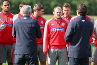 ST ALBANS, ENGLAND - SEPTEMBER 04:  (L-R) Joleon Lescott, Wayne Rooney and David Beckham listen to England manager Fabio Capello as he talks to the players during the England team training session at London Colney on September 4, 2009 in St Albans, England.  (Photo by Mark Thompson/Getty Images)
