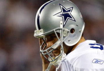 ARLINGTON, TX - SEPTEMBER 20:  Quarterback Tony Romo #9 of the Dallas Cowboys walks off the field during play against the New York Giants at Cowboys Stadium on September 20, 2009 in Arlington, Texas.  (Photo by Ronald Martinez/Getty Images)