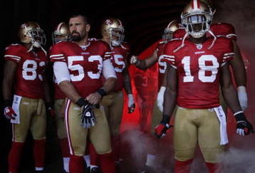 SAN FRANCISCO - SEPTEMBER 20:  The San Francisco 49ers starting line up prepare to enter the field during their home opener against the Seattle Seahawks at Candlestick Park on September 20, 2009 in San Francisco, California.  (Photo by David Paul Morris/Getty Images)