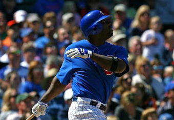 CHICAGO - AUGUST 30: Milton Bradley #21 of the Chicago Cubs follows the flight of the ball against the New York Mets on August 30, 2009 at Wrigley Field in Chicago, Illinois. The Mets defeated the Cubs 4-1. (Photo by Jonathan Daniel/Getty Images)