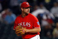 ARLINGTON, TX - SEPTEMBER 12:  Pitcher Kevin Millwood #33 of the Texas Rangers throws against the Seattle Mariners on September 12, 2009 at the Ballpark in Arlington, Texas.  (Photo by Ronald Martinez/Getty Images)