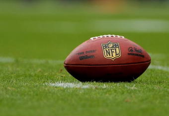 DENVER - SEPTEMBER 20:  The football awaits action as it lies on the turf as the Cleveland Browns face the Denver Broncos during NFL action at Invesco Field at Mile High on September 20, 2009 in Denver, Colorado. The Broncos defeated the Browns 27-6.  (Photo by Doug Pensinger/Getty Images)
