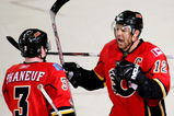 CALGARY, AB - APRIL 22: Jarome Iginla #12 and Dion Phaneuf #3 of the Calgary Flames celebrate Iginla's empty net goal to seal the win against the Chicago Blackhawks in Game Four of the Western Conference Quarterfinals of the 2009 Stanley Cup Playoffs on April 22, 2009 at the Pengrowth Saddledome in Calgary, Alberta, Canada. (Photo by Mike Ridewood/Getty Images)