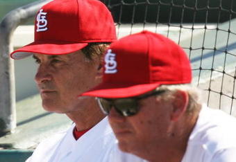 JUPITER, FL - MARCH 2:  Manager Tony La Russa #10 (L) and pitching coach Dave Duncan #18 of the St. Louis Cardinals watch as the New York Mets take a four run lead in the first inning during a spring training game at Roger Dean Stadium on March 2, 2006 in Jupiter, Florida. The Mets defeated the Cards 12-7.  (Photo by Doug Benc/Getty Images)