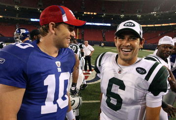 EAST RUTHERFORD, NJ - AUGUST 29:  Eli Manning #10 of the New York Giants talks with Mark Sanchez #6 of the New York Jets after their game on August 29, 2009 at Giants Stadium in East Rutherford, New Jersey.  (Photo by Jim McIsaac/Getty Images)