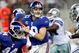 ARLINGTON, TX - SEPTEMBER 20: Quarterback Eli Manning #10 of the New York Giants drops back to pass against the Dallas Cowboys at Cowboys Stadium on September 20, 2009 in Arlington, Texas. (Photo by Ronald Martinez/Getty Images)