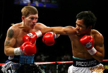 LAS VEGAS - MAY 02:  (R-L) Manny Pacquiao of the Philippines throws a right to the face of Ricky Hatton of England in the first round of their junior welterweight title fight at the MGM Grand Garden Arena May 2, 2009 in Las Vegas, Nevada. Pacquiao defeated Hatton by 2nd round TKO. (Photo by Al Bello/Getty Images)