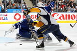 TORONTO - APRIL 8:  Adam Mair #22 of the Buffalo Sabres missed on this scoring opportunity as Curtis Joseph #31 of the Toronto Maple Leafs dives across the crease during their NHL game at the Air Canada Centre April 8, 2009 in Toronto, Ontario.(Photo By Dave Sandford/Getty Images)