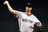 KANSAS CITY, MO - SEPTEMBER 21:  Starting pitcher Tim Wakefield #49 of the Boston Red Sox pitches during warm-ups just prior to the start of the game against the Kansas City Royals on September 21, 2009 at Kauffman Stadium in Kansas City, Missouri.  (Photo by Jamie Squire/Getty Images)