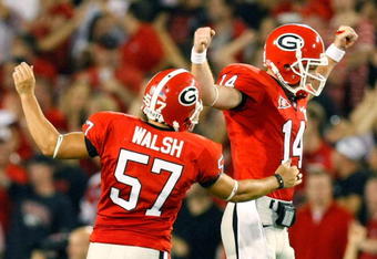 ATHENS, GA - SEPTEMBER 12:  Quarterback Joe Cox #14 and Blair Walsh #57 celebrate a touchdown against the Georgia Bulldogs of the South Carolina Gamecocks at Sanford Stadium on September 12, 2009 in Athens, Georgia.  (Photo by Kevin C. Cox/Getty Images)
