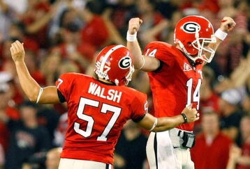 ATHENS, GA - SEPTEMBER 12:  Quarterback Joe Cox #14 and Blair Walsh #57 celebrate a touchdown against the Georgia Bulldogs of the South Carolina Gamecocks at Sanford Stadium on September 12, 2009 in Athens, Georgia.  (Photo by Kevin C. Cox/Getty Images)