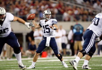 ARLINGTON, TX - SEPTEMBER 05:  Quarterback Max Hall #15 of the Brigham Young Cougars drops back to pass against the Oklahoma Sooners at Cowboys Stadium on September 5, 2009 in Arlington, Texas.  (Photo by Ronald Martinez/Getty Images)