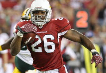 GLENDALE, AZ - AUGUST 28:  Running back Beanie Wells #26 of the Arizona Cardinals rushes for a touchdown during the second quarter against the Green Bay Packers at the University of Phoenix Stadium on August 28, 2009 in Glendale, Arizona.  (Photo by Christian Petersen/Getty Images)