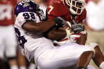 NORMAN, OK - SEPTEMBER 27:  Running back DeMarco Murray #7 of the Oklahoma Sooners is tackled by Jerry Hughes #98 of the TCU Horned Frogs at Memorial Stadium on September 27, 2008 in Norman, Oklahoma.  (Photo by Ronald Martinez/Getty Images)