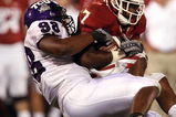 NORMAN, OK - SEPTEMBER 27:  Running back DeMarco Murray #7 of the Oklahoma Sooners is tackled by Jerry Hughes #98 of the TCU Horned Frogs at Memorial Stadium on September 27, 2008 in Norman, Oklahoma.  (Photo by Ronald Martinez/Getty Images)